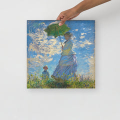 A Madame Monet and Her Son by Claude Monet poster on a plain backdrop in size 16x16”.