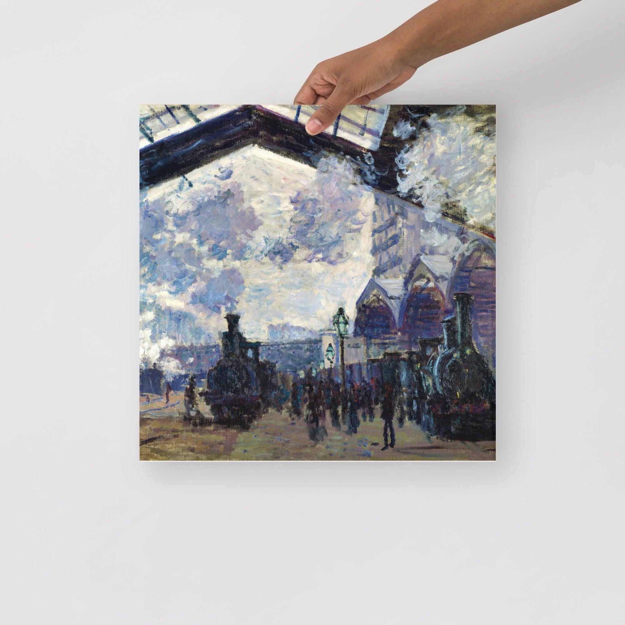 The Gare St-Lazare by Claude Monet  poster on a plain backdrop in size 16x16”.
