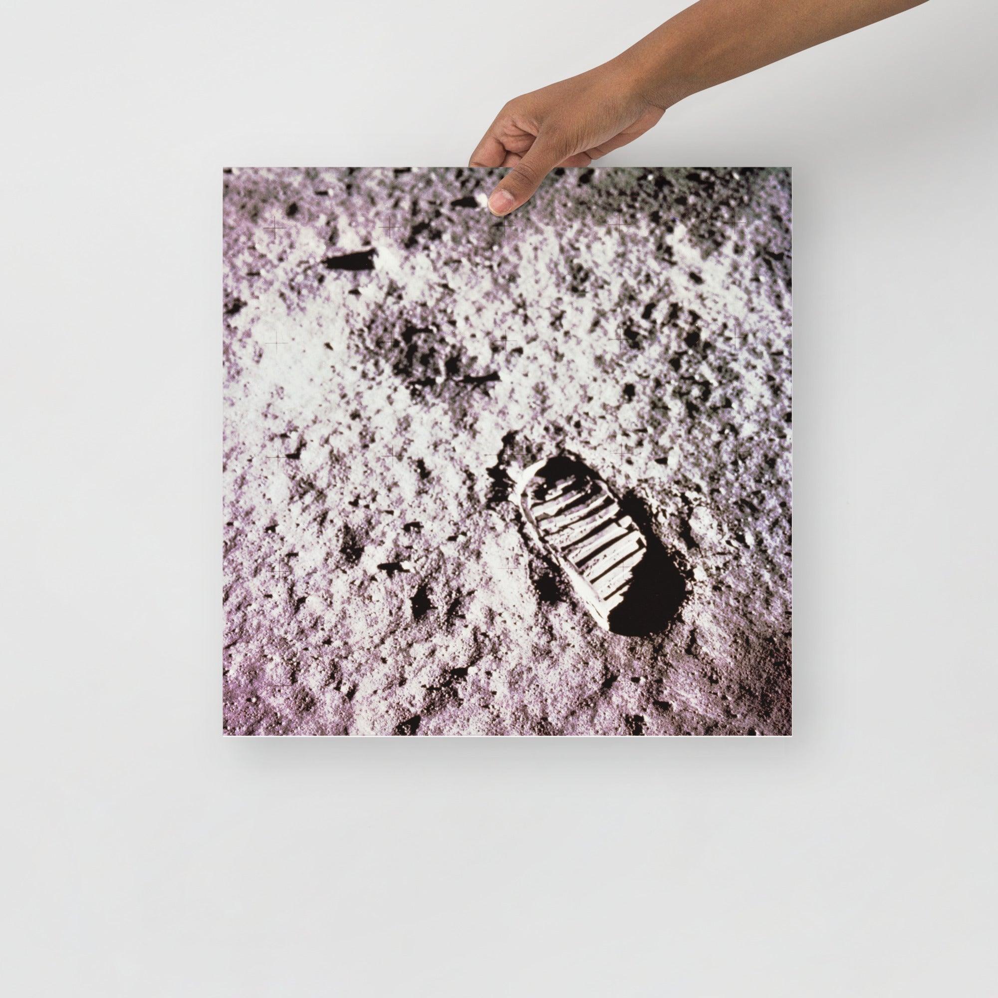 A Footprint on the Moon Apollo 11 poster on a plain backdrop in size 16x16”.