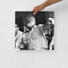 An Ernest Hemingway at a Bar poster on a plain backdrop in size 16x16”.
