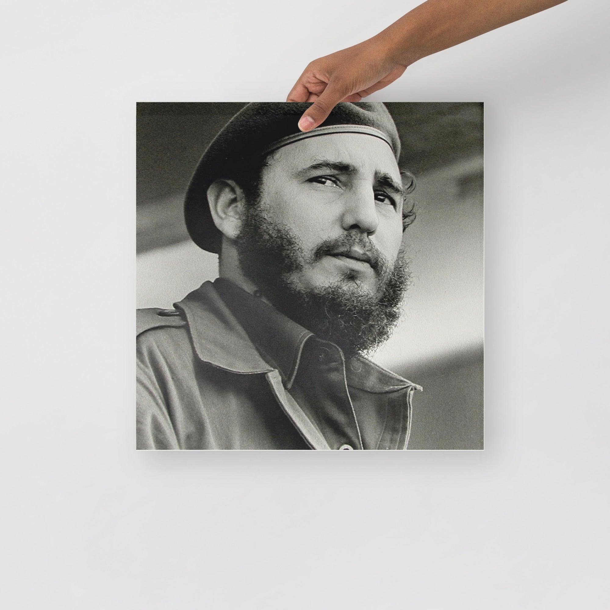 A Fidel Castro poster on a plain backdrop in size 16x16”.