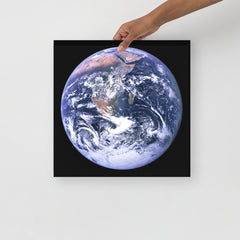 The Blue Marble poster on a plain backdrop in size 16x16”.