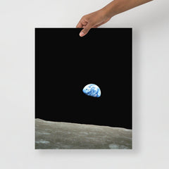 An Earthrise Apollo 8 poster on a plain backdrop in size 16x20”.