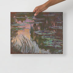 A Water Lilies by Claude Monet poster on a plain backdrop in size 16x20”.