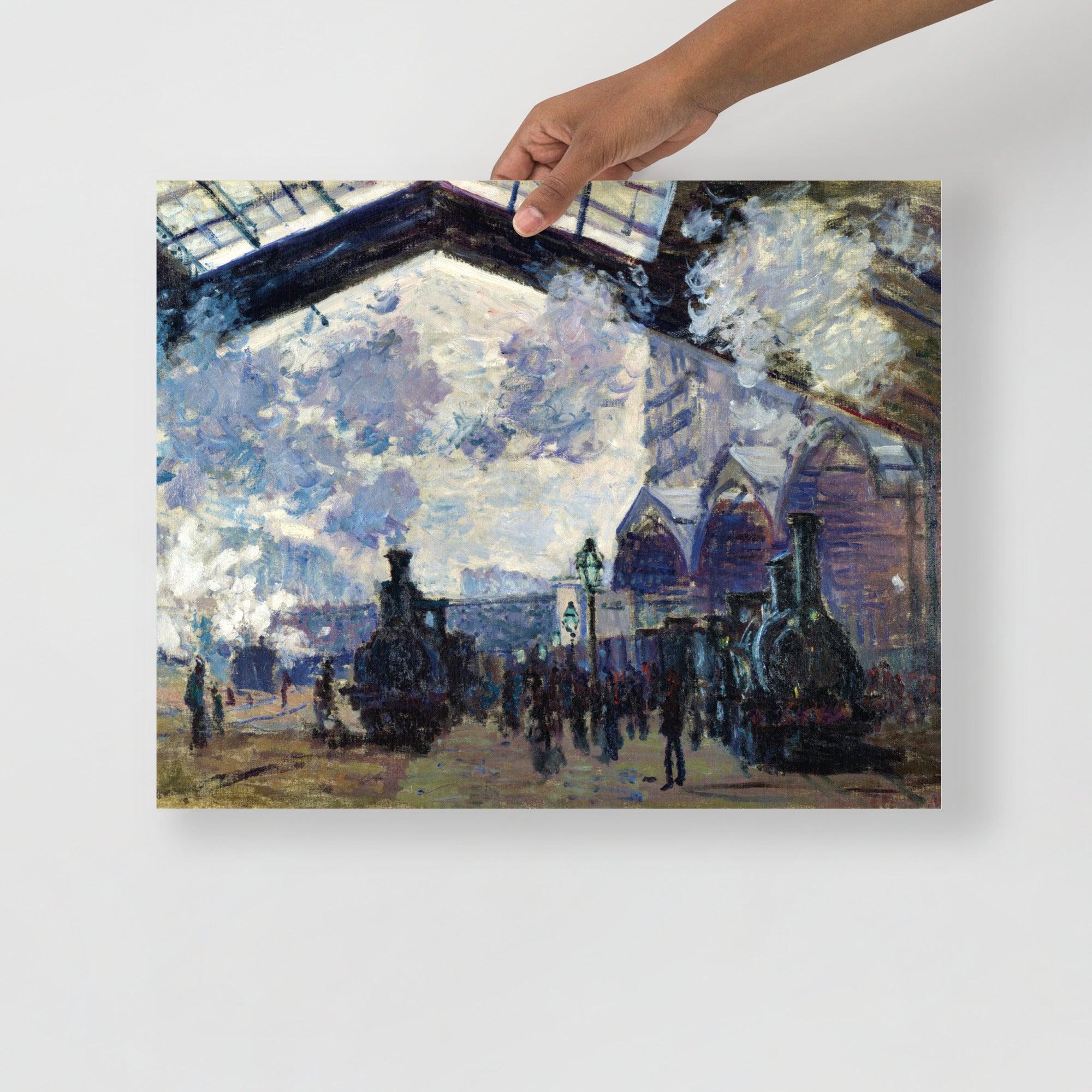 The Gare St-Lazare by Claude Monet  poster on a plain backdrop in size 16x20”.