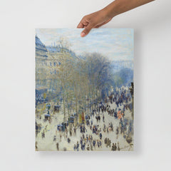 A Boulevard des Capucines by Claude Monet poster on a plain backdrop in size 16x20”.