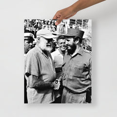 An Ernest Hemingway with Fidel Castro poster on a plain backdrop in size 16x20”.