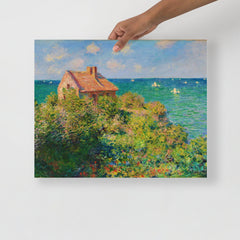 A Fisherman's Cottage at Varengeville by Claude Monet poster on a plain backdrop in size 16x20”.