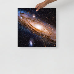 An Andromeda Galaxy poster on a plain backdrop in size 18x18”.