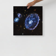 A Cartwheel Galaxy by James Webb Space Telescope poster on a plain backdrop in size 18x18”.