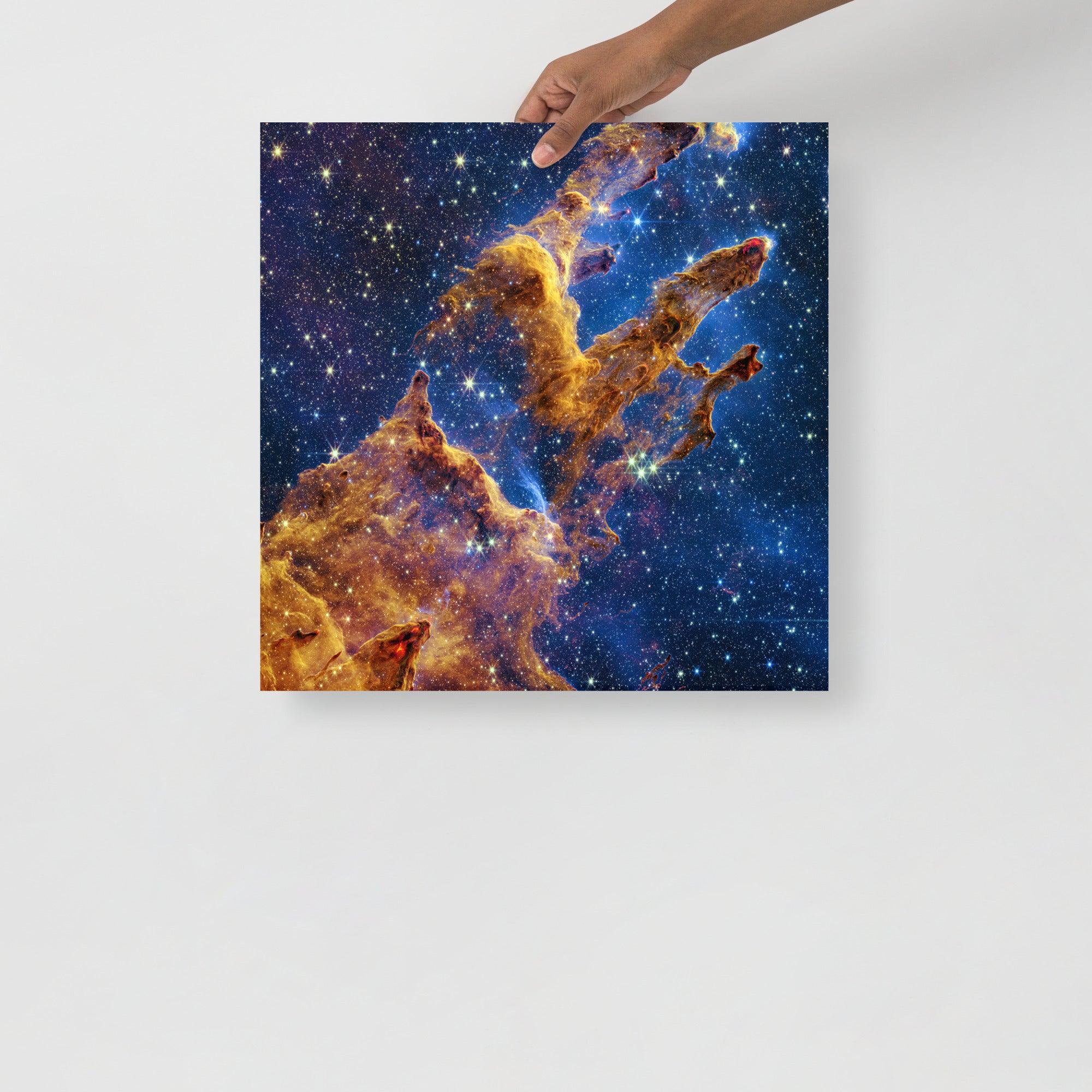A Pillars of Creation by James Webb Telescope poster on a plain backdrop in size 18x18”.