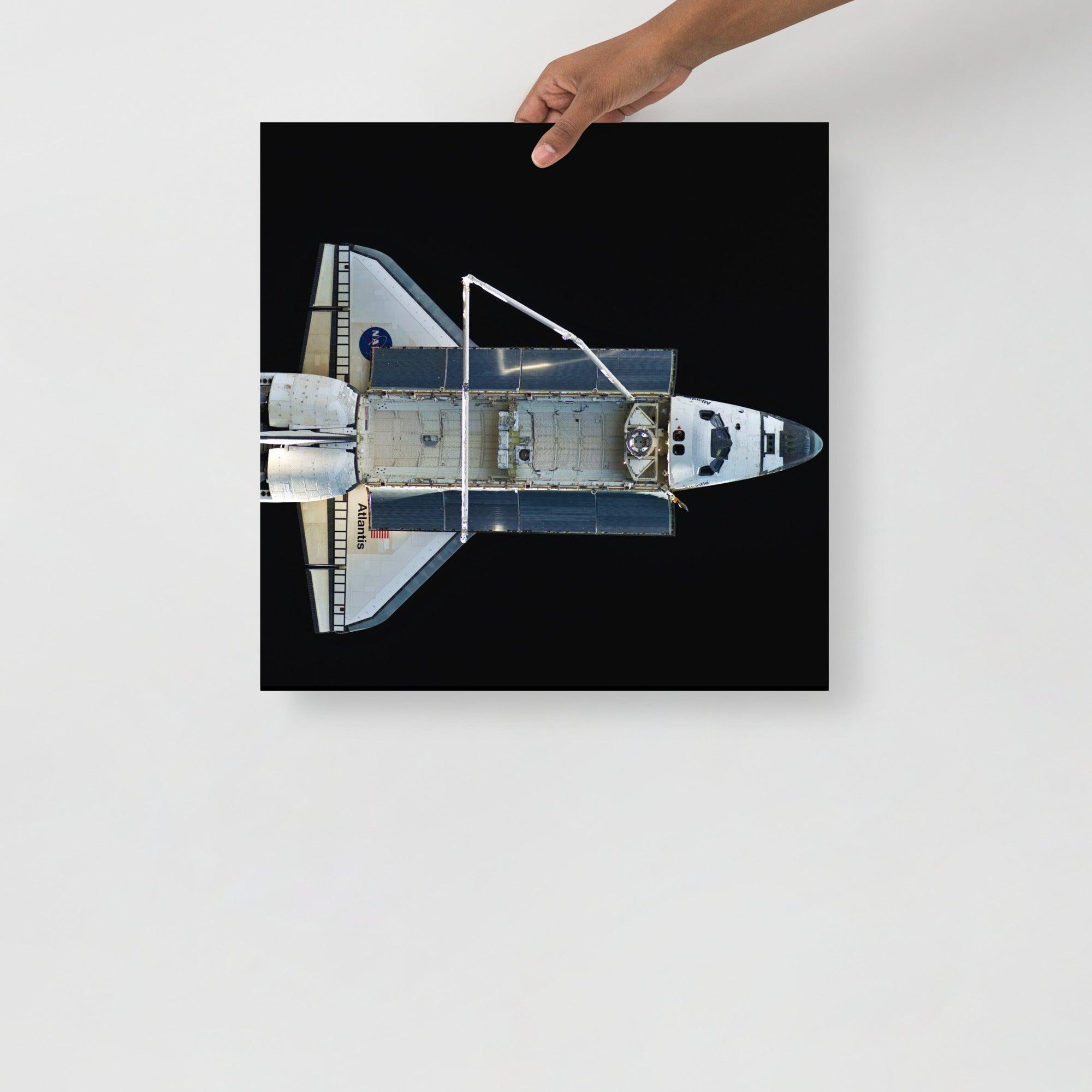 A Space Shuttle Atlantis poster on a plain backdrop in size 18x18”.