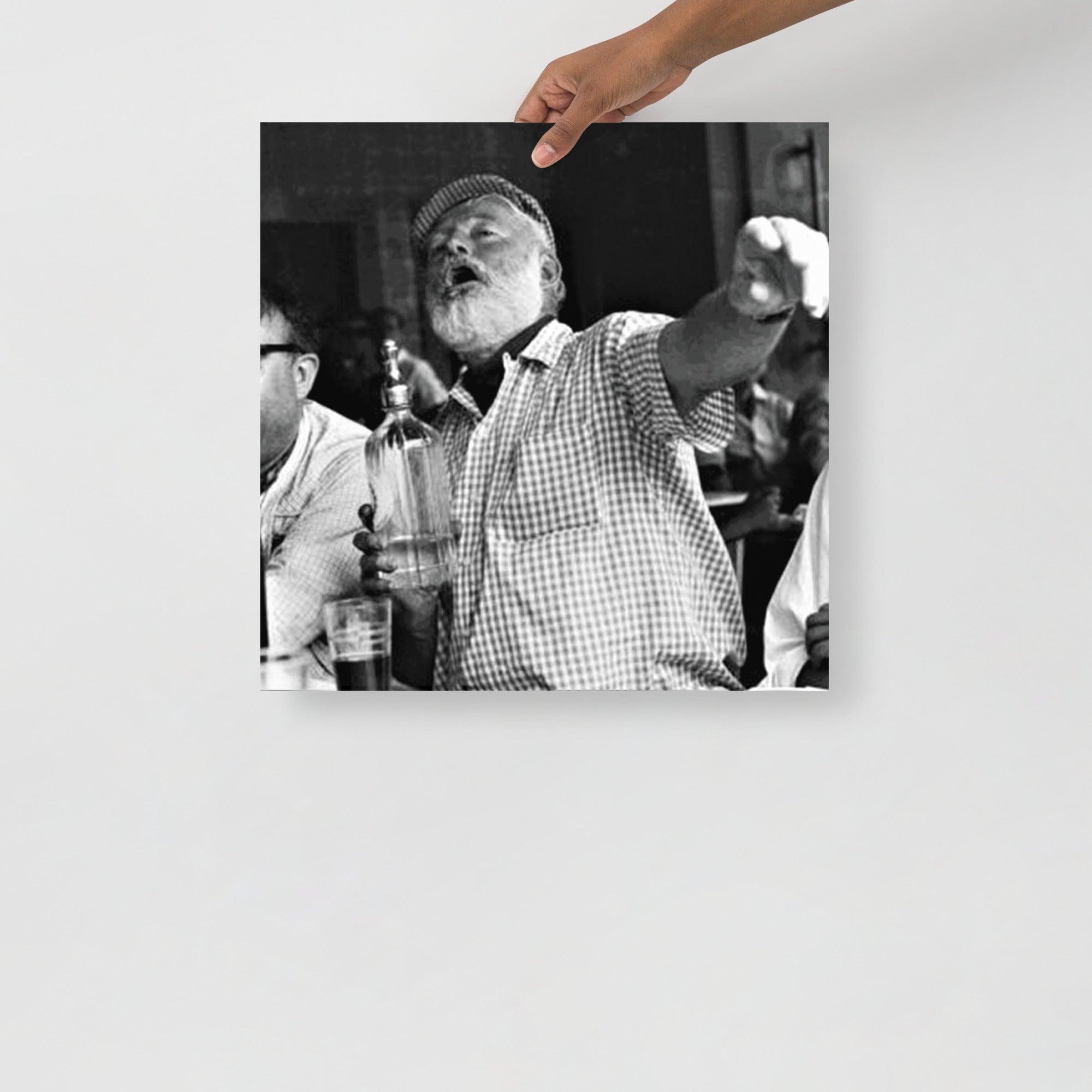 An Ernest Hemingway at a Bar poster on a plain backdrop in size 18x18”.