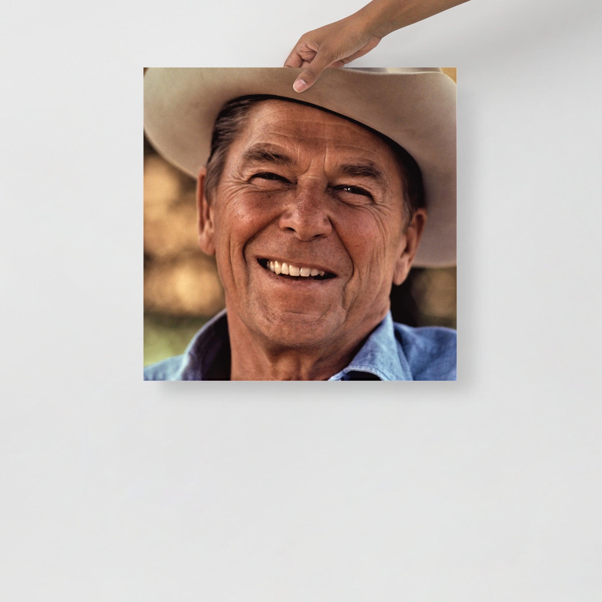A Ronald Reagan Cowboy Hat poster on a plain backdrop in size 18x18”.