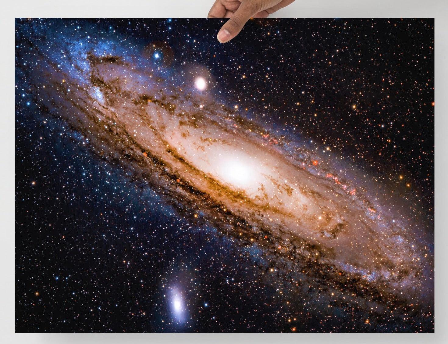 An Andromeda Galaxy poster on a plain backdrop in size 18x24”.