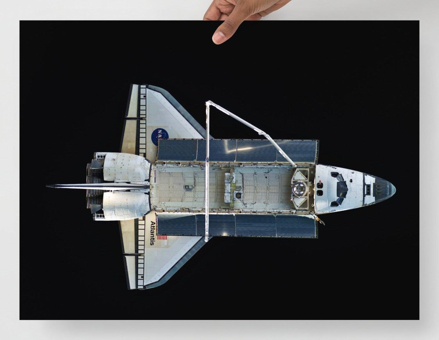 A Space Shuttle Atlantis poster on a plain backdrop in size 18x24”.