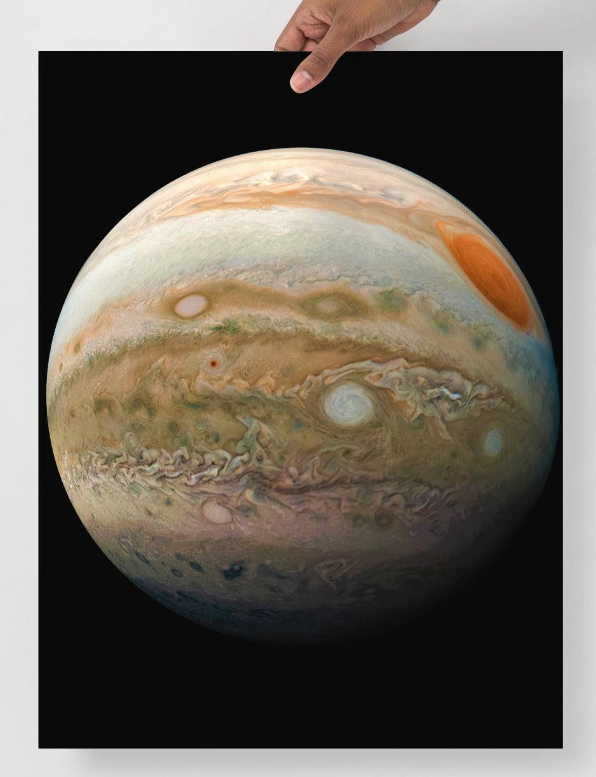 A Planet Jupiter From the Juno Spacecraft  poster on a plain backdrop in size 18x24”.