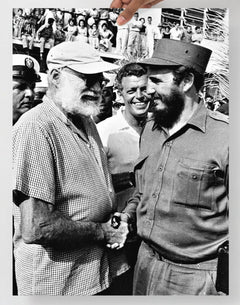 An Ernest Hemingway with Fidel Castro  poster on a plain backdrop in size 18x24”.