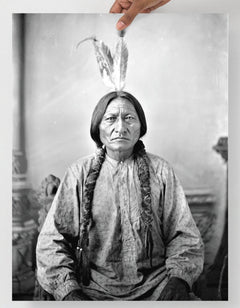 A Sitting Bull Portrait  poster on a plain backdrop in size 18x24”.