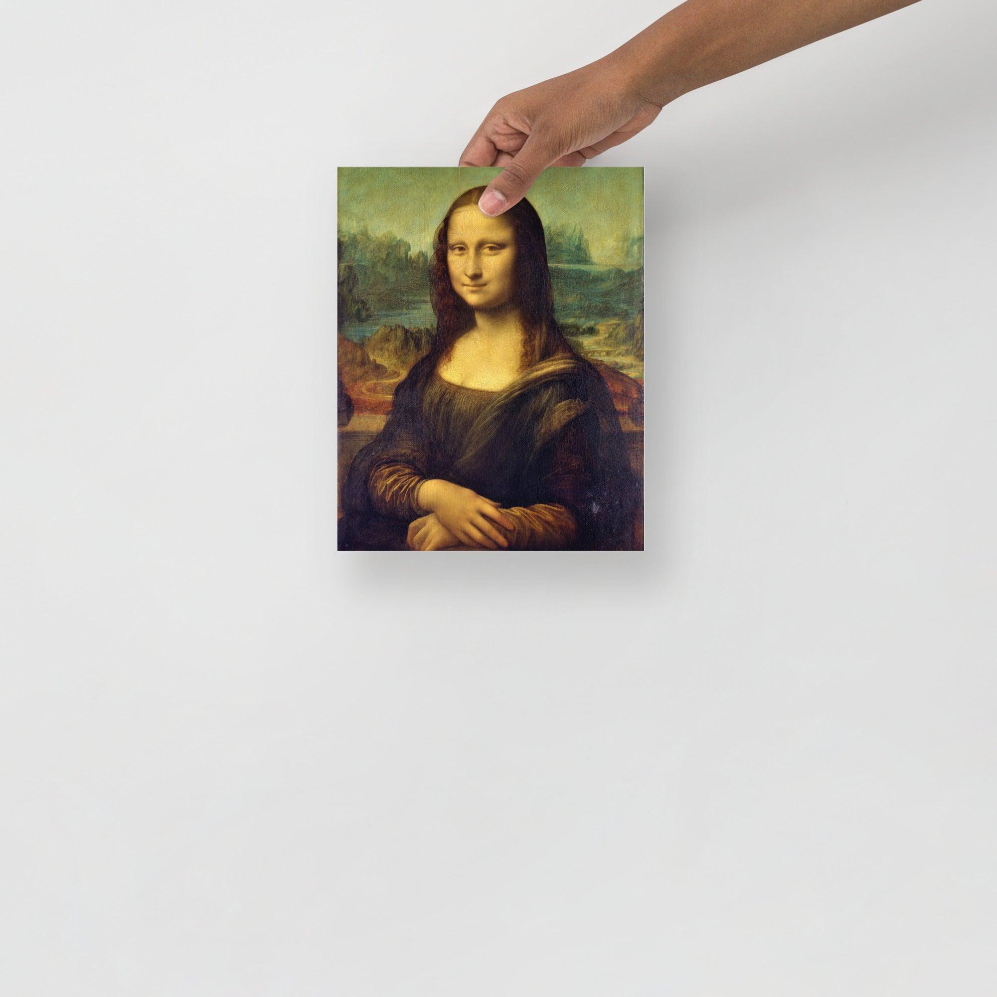 A Mona Lisa by Leonardo Da Vinci poster on a plain backdrop in size 8x10”.