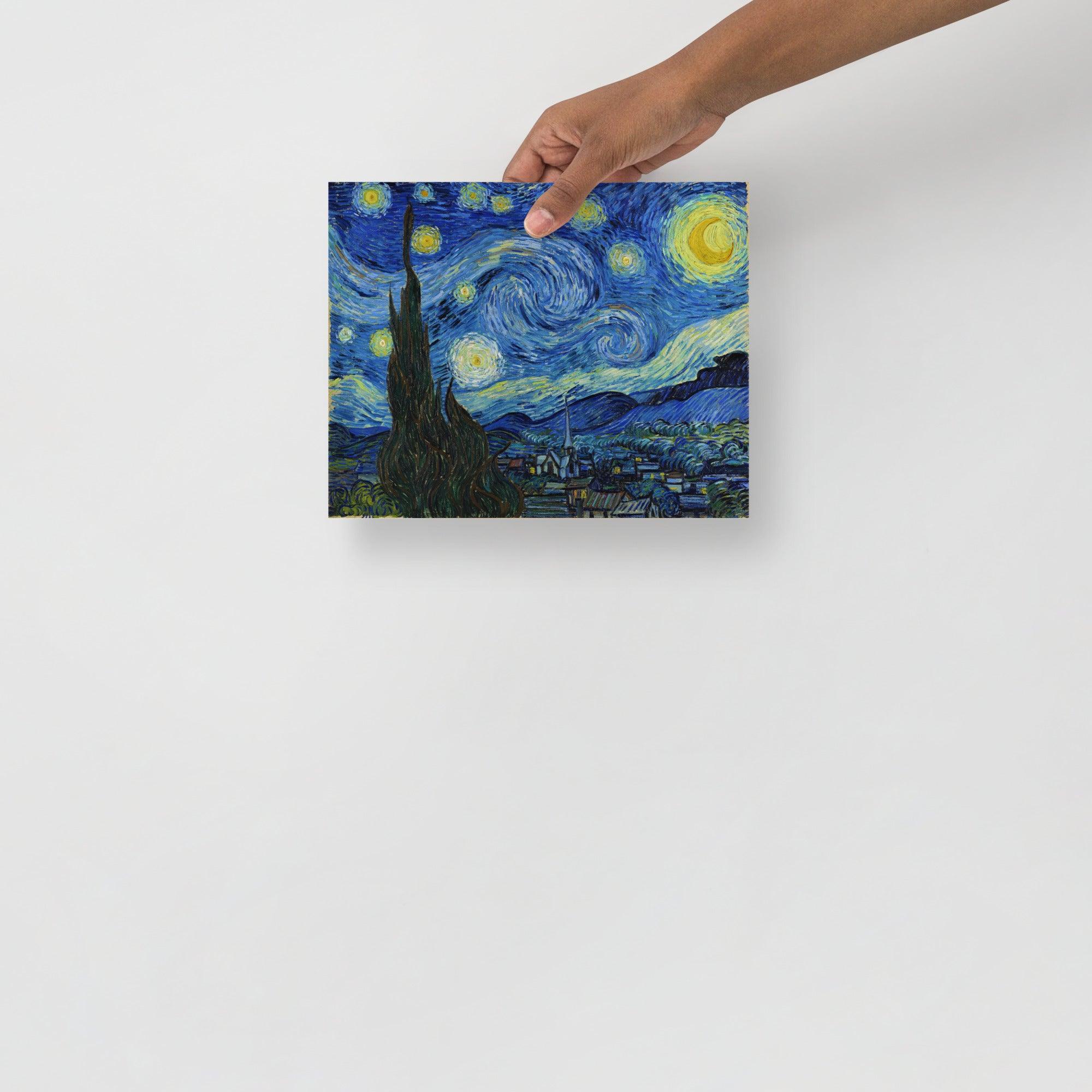 A The Starry Night by Vincent van Gogh poster on a plain backdrop in size 8x10”.