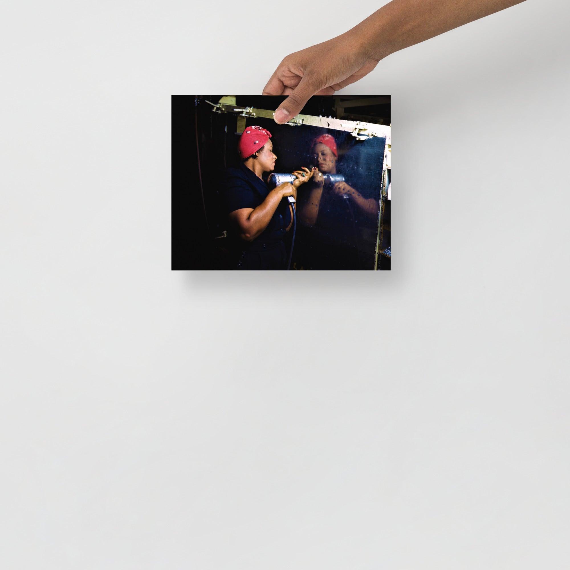 A Rosie the Riveter poster on a plain backdrop in size 8x10”.