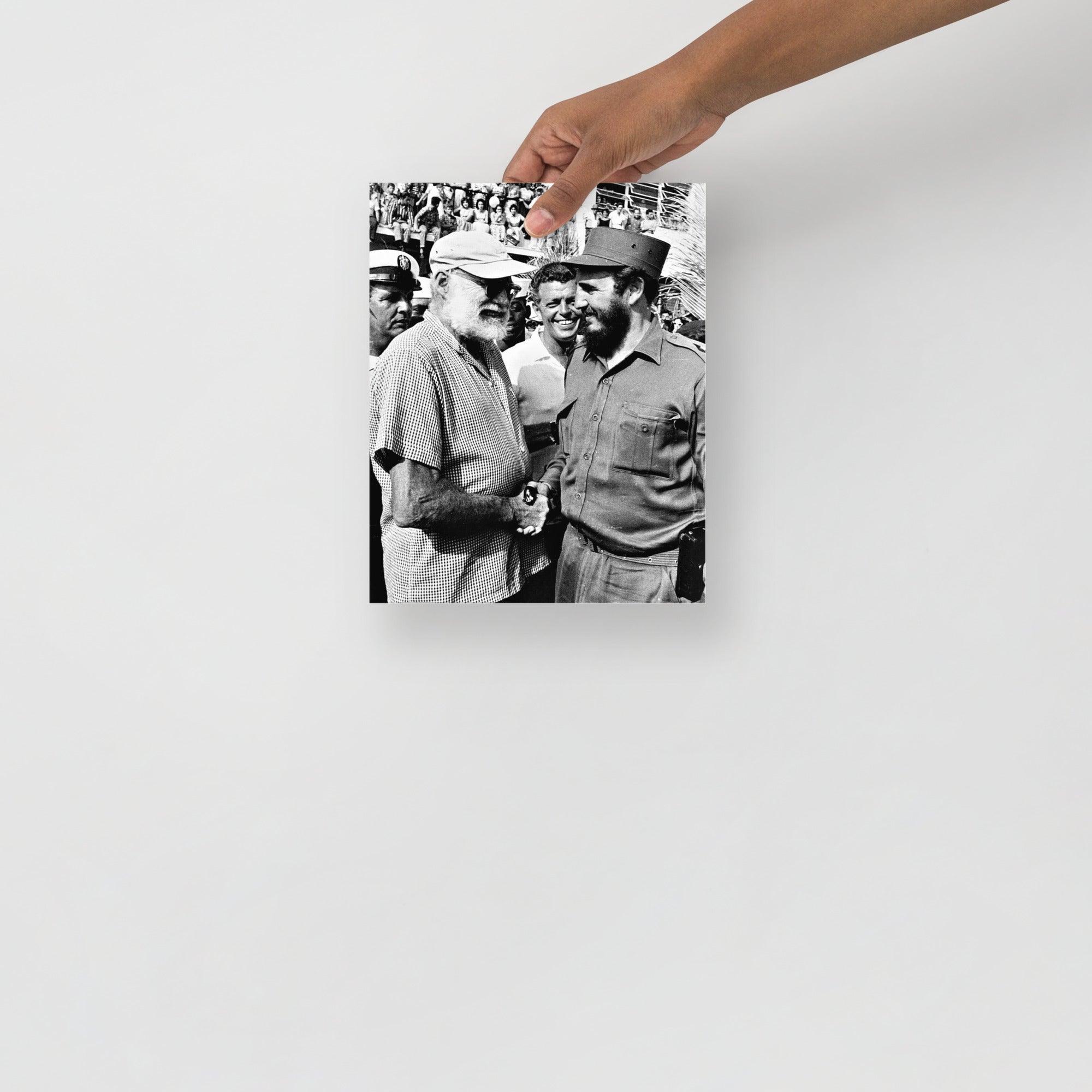 An Ernest Hemingway with Fidel Castro poster on a plain backdrop in size 8x10”.