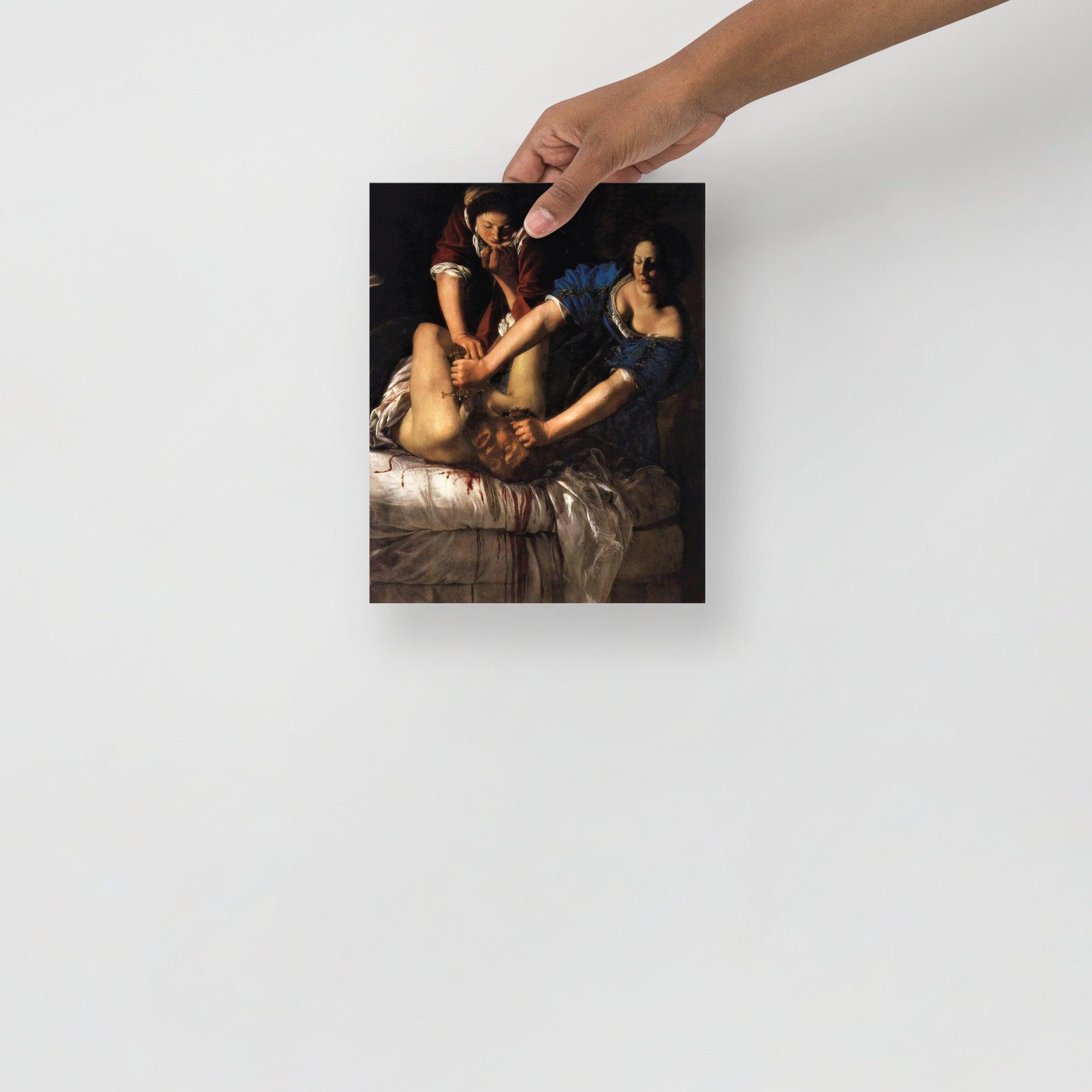 A Judith beheading Holofernes by Artemisia Gentileschi poster on a plain backdrop in size 8x10”.