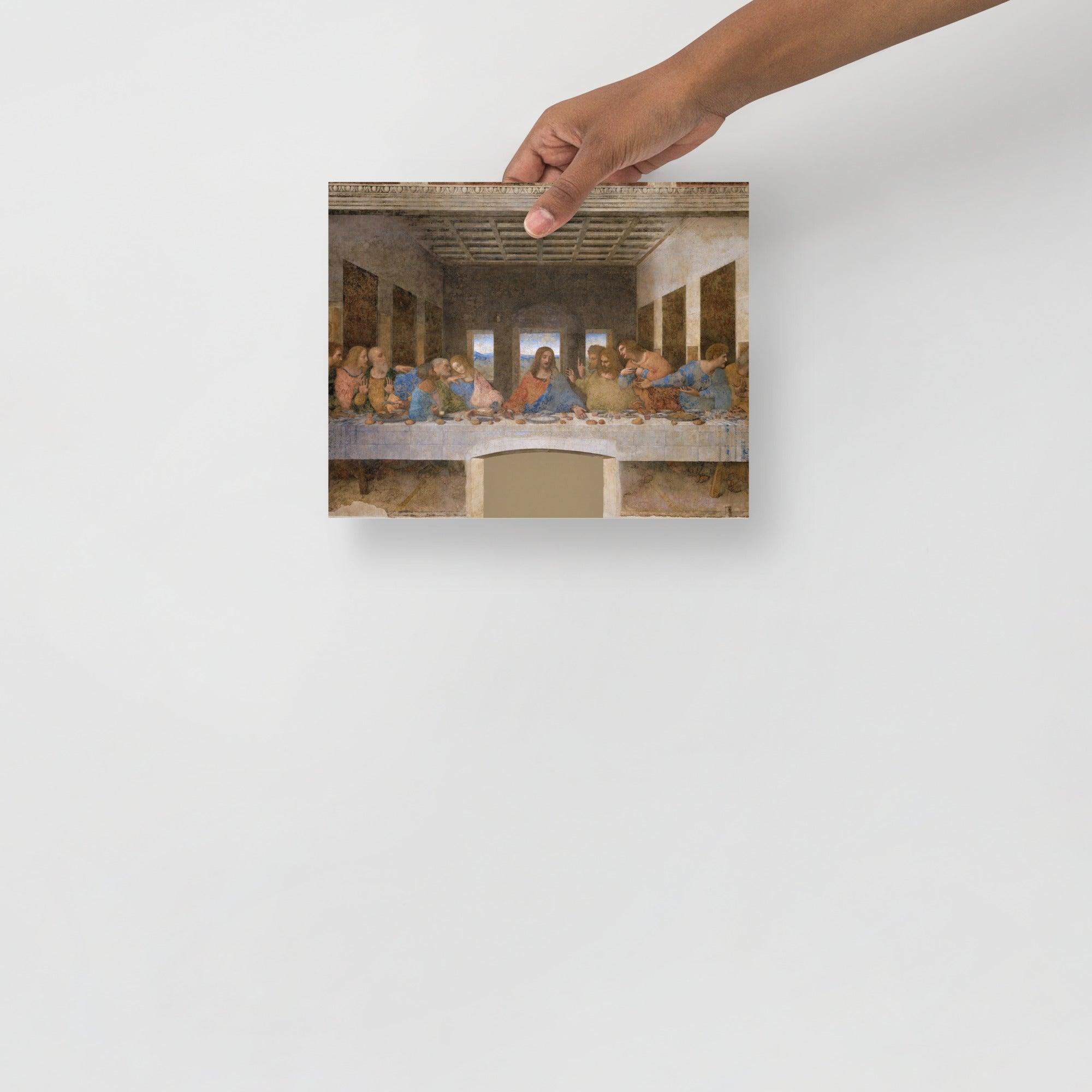 The Last Supper by Leonardo Da Vinci poster on a plain backdrop in size 8x10”.