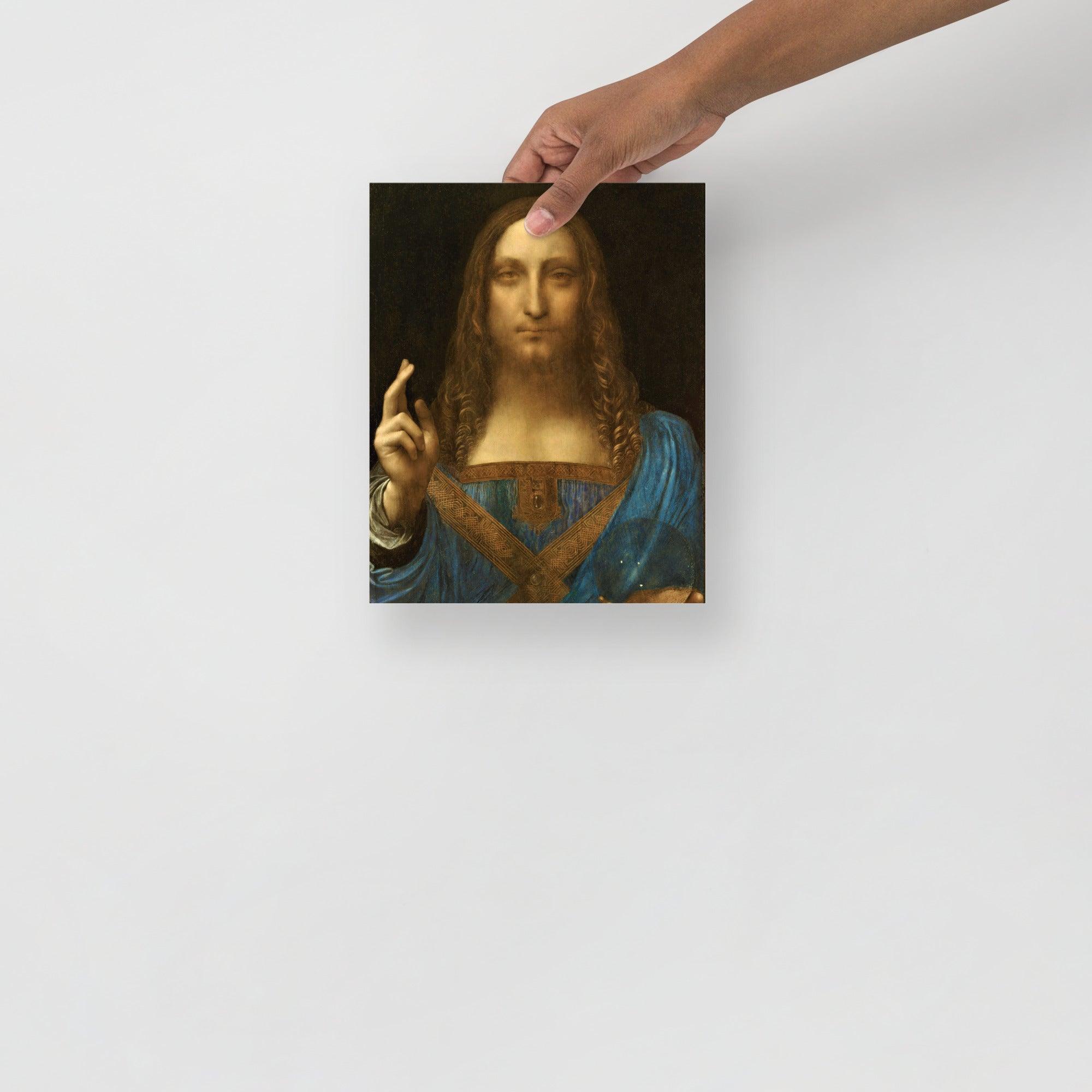 A Salvator Mundi by Leonardo Da Vinci poster on a plain backdrop in size 8x10”.