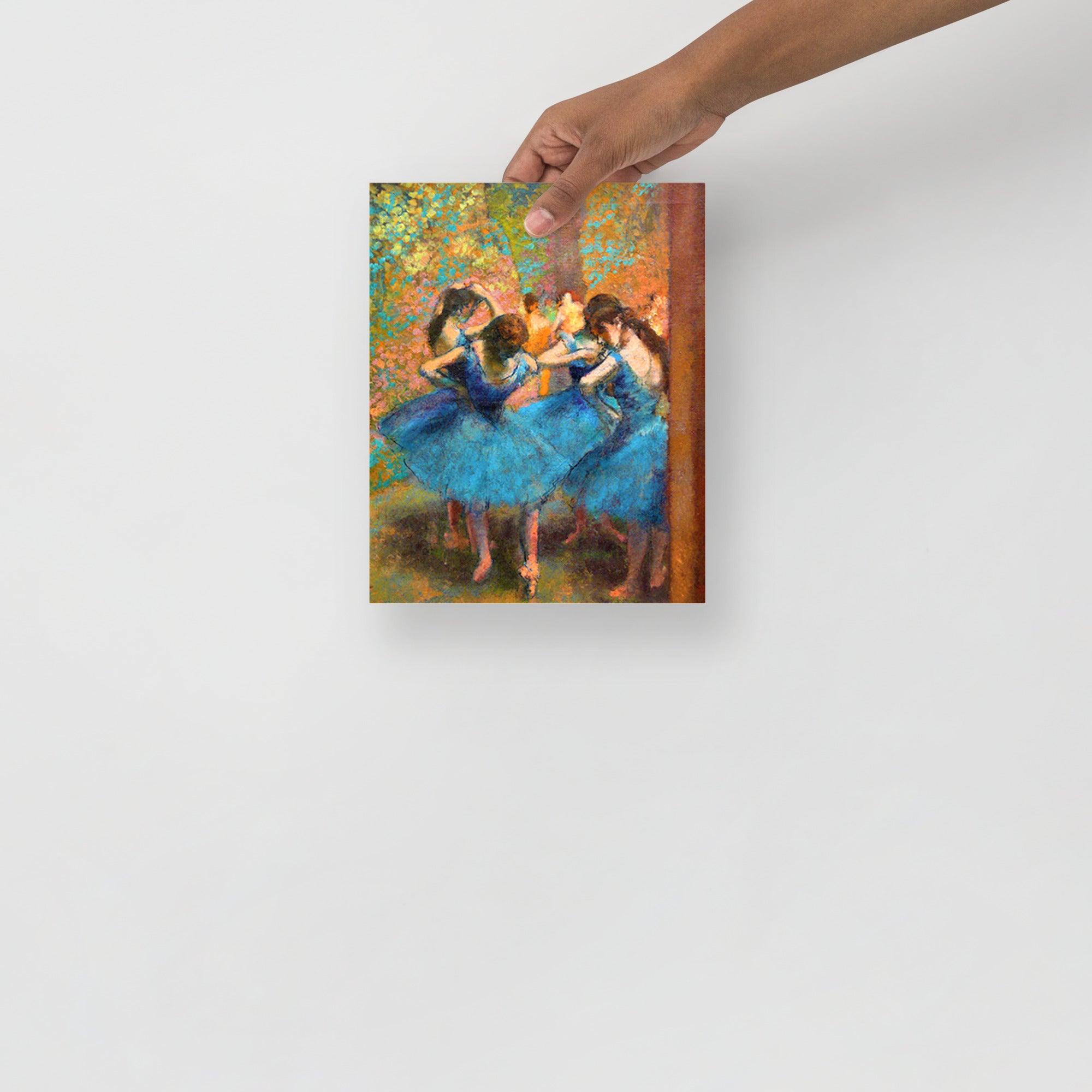 A Dancers in Blue by Edgar Degas poster on a plain backdrop in size 8x10”.